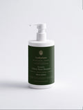 Keratin Volume Boost Shampoo — 390 ml dark green SEV Apothecary bottle with a white pump, The Hair Composition, on a plain studio background.