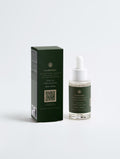 Scalp Care Exfoliating Serum — 30 ml dropper bottle beside its dark green SEV Apothecary carton, The Hair Composition, on a plain studio background.