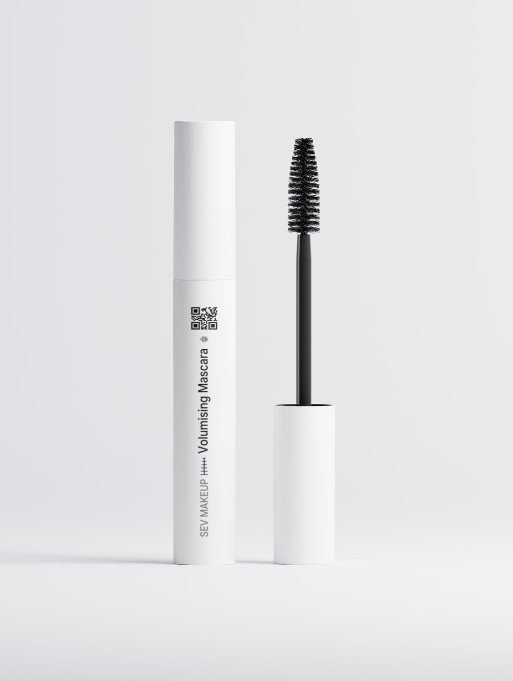SEV Makeup Volumising Mascara, the white tube standing beside its wand, showing the SwordEyeVisions sigil, the Eyes index rule, the SEV MAKEUP line running up the tube and a QR code linking to SEV Makeup.