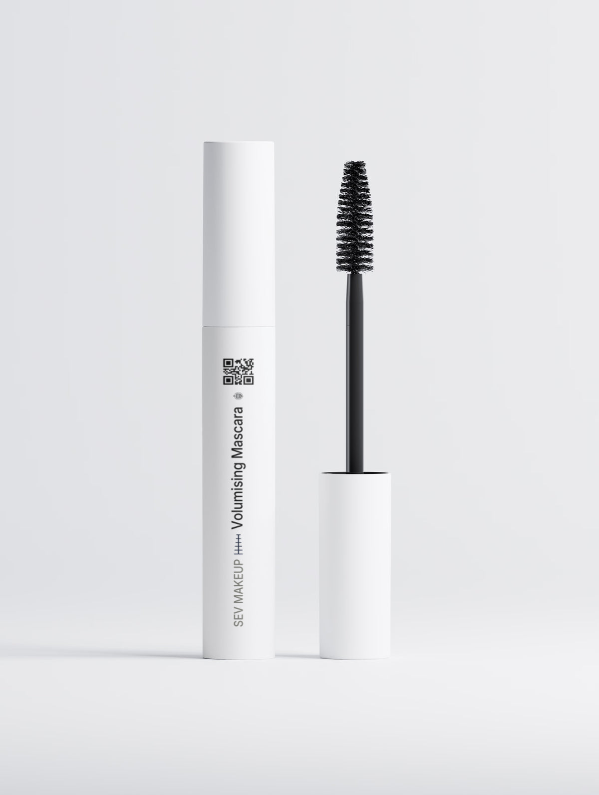 SEV Makeup Volumising Mascara, the white tube standing beside its wand, showing the SwordEyeVisions sigil, the Eyes index rule, the SEV MAKEUP line running up the tube and a QR code linking to SEV Makeup.