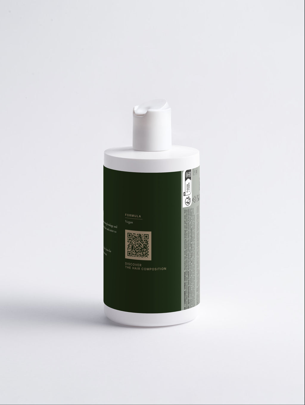 The same bottle rotated to show the formula panel with the Hair Composition QR code and the printed multilingual regulatory panel.