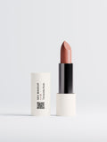 SEV Makeup Matte Lipstick in Terracotta Nude: the cream cap carries a vertical SEV MAKEUP wordmark, the shade name, an oxblood two-position index and a QR code, beside the open lipstick bullet.