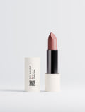 SEV Makeup Matte Lipstick in Dusty Rose: the cream cap carries a vertical SEV MAKEUP wordmark, the shade name, an oxblood two-position index and a QR code, beside the open lipstick bullet.